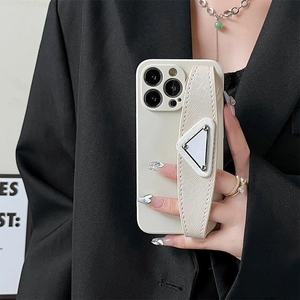 Ivory protective phone case with a textured leather wrist strap and silver triangle metal piece