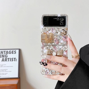 Detailed macro of Samsung Z Flip case with pink rhinestones and a luxury bow pendant