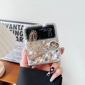 Detail of luxury rhinestone bow phone case for Samsung Z Flip with golden mini bag charm