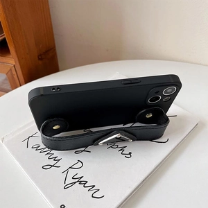 Detail of black lychee leather phone hand strap with premium silver metal buckle