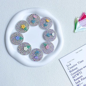 Detailed set of 8 rhinestone tulip flower phone grips displayed on a cloud tray