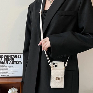 White quilted crossbody phone wallet case with gold clasp and leather shoulder strap