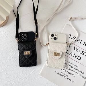 Quilted leather crossbody phone case with gold metal clasp in black and white
