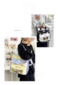 Detail of cute cat-ear tote bag with clear PVC window and plush toy interior