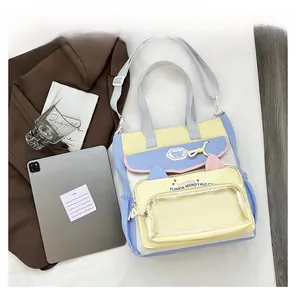 Detailed size comparison of a colorful canvas tote bag next to an iPad with cute cat ears