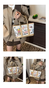 Macro detail of graffiti bucket bag featuring colorful bear and shark illustrations