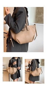 Detail der beigen Shopper-Tasche mit hochwertiger Litschi-Lederstruktur und Kordelzug