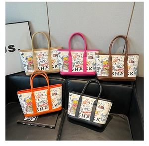 Detailed group view of colorful graffiti canvas tote bags in five stylish color options
