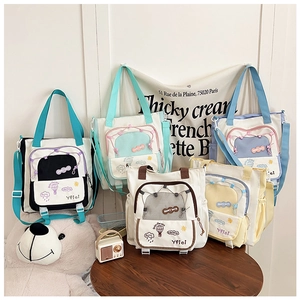 Collection of colorful canvas tote bags with cute cartoon prints and shoulder straps