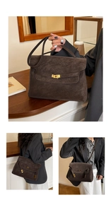 Macro detail of the dark brown suede bag featuring a gold metal lock and vintage buckle