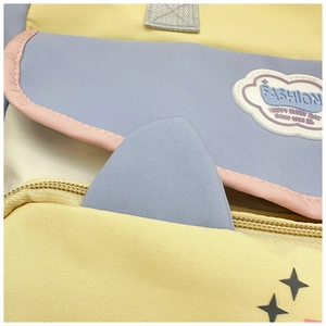 Detail of colorful macaron backpack showing fine fabric texture and cloud emblem
