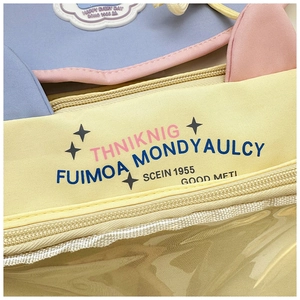 Detail of yellow and blue cat-ear tote bag with a transparent frosted window and star motifs