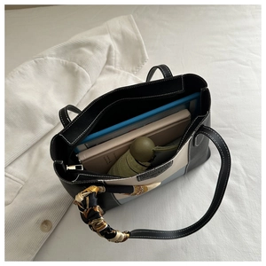 Top view of spacious tote bag showing interior storage for tablet, book and umbrella