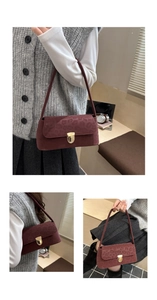Detail view of burgundy baguette bag with leopard print texture and gold clasp