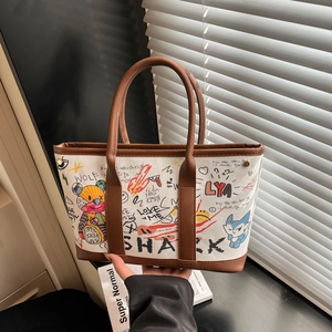 Sac seau en toile graffiti artistique avec poignées en cuir marron et ombre douce
