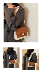 Detail of color-block crossbody bag with wide strap and fashion text on brown flap