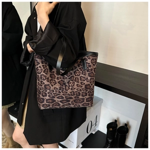 Leopard print tote bag styled with a black trench coat for a trendy autumn look
