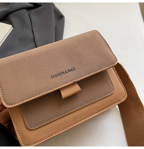 Detail of caramel crossbody bag featuring mixed textures and wide woven shoulder strap