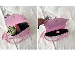 Pink pearl chain bag main pocket showing capacity for phone and folding umbrella