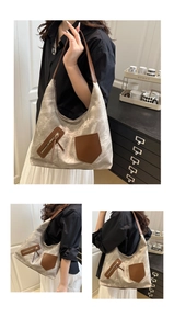Details der Vintage-Canvas-Tasche mit braunen Ledertaschen und Metallreißverschluss