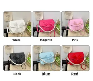 Detail of elegant handbags with pearl handles and decorative mesh bows in six colors