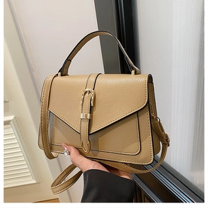 Chic beige textured leather crossbody bag with metal buckle and top handle for women