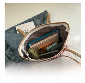 Detailed interior view of graffiti tote bag showing large capacity for tablet and daily items