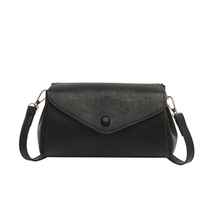 Minimalist black envelope flap shoulder bag in textured PU leather with gold hardware