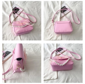 Detail shots of pink crossbody bag with mesh bow and decorative pearl handle chain