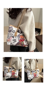 Detail of white graffiti tote bag featuring colorful animal prints and plush cloud charm