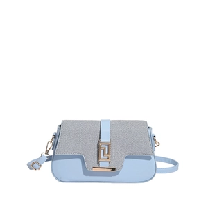 Chic light blue crossbody saddle bag with textured flap and golden geometric metal buckle