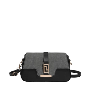 Minimalist two-tone saddle bag with black leather, grey fabric, and gold buckle