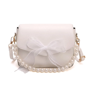White shoulder bag with large organza bow and pearl handle on a clean white background