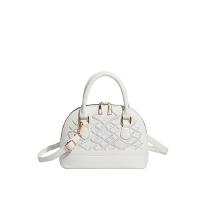 White shell bag with wave embroidery, top handles, and adjustable shoulder strap