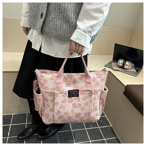 Pink jacquard tote bag with multiple pockets and Fashion Instinct label for daily commute