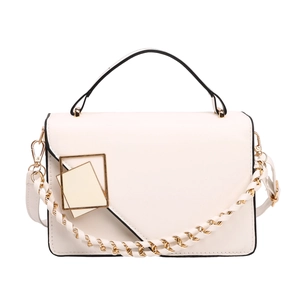 Minimalist white flap bag with black piping and gold geometric buckle on white background