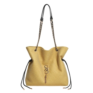 Large yellow textured tote bag with golden chain strap and stylish letter S tassel detail