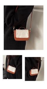 Detail of wool saddle bag featuring brown faux leather and white lamb wool texture