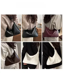 Detailed close-up of retro hobo bag colors and textures with adjustable metal buckle strap