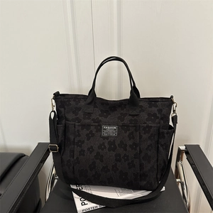 Black floral jacquard tote bag with multi-pockets and adjustable shoulder strap for daily use