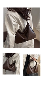 Detailed macro view of dark brown faux leather texture and golden zipper hardware