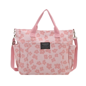 Pink floral canvas tote bag for women with daisy pattern and adjustable strap