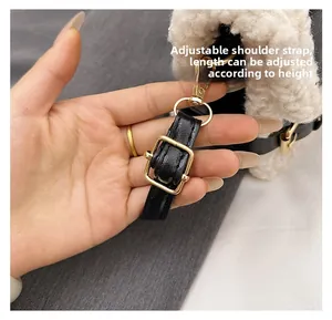 Detail of adjustable leather strap with gold hardware and white faux fur texture