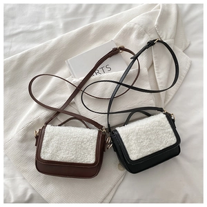 Detailed top view of vintage lamb wool crossbody bags in brown and black leather