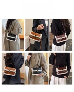 Detail view of faux shearling crossbody bag showing metal turn-lock and leather straps