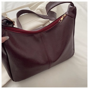 Detailed top view of a burgundy retro PU leather handbag with elegant pleat texture