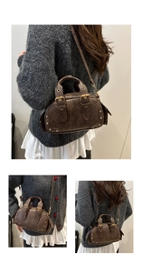 Detail of vintage brown bowling bag with gold studs and textured leather finish