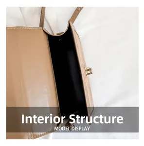 Detail view of the brown shoulder bag interior main compartment with black lining