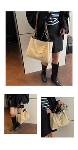 Detail of a beige tote bag featuring a decorative pearl chain and brown leather strap