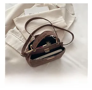 Internal view of a leopard print suede tote showing capacity for phone and makeup